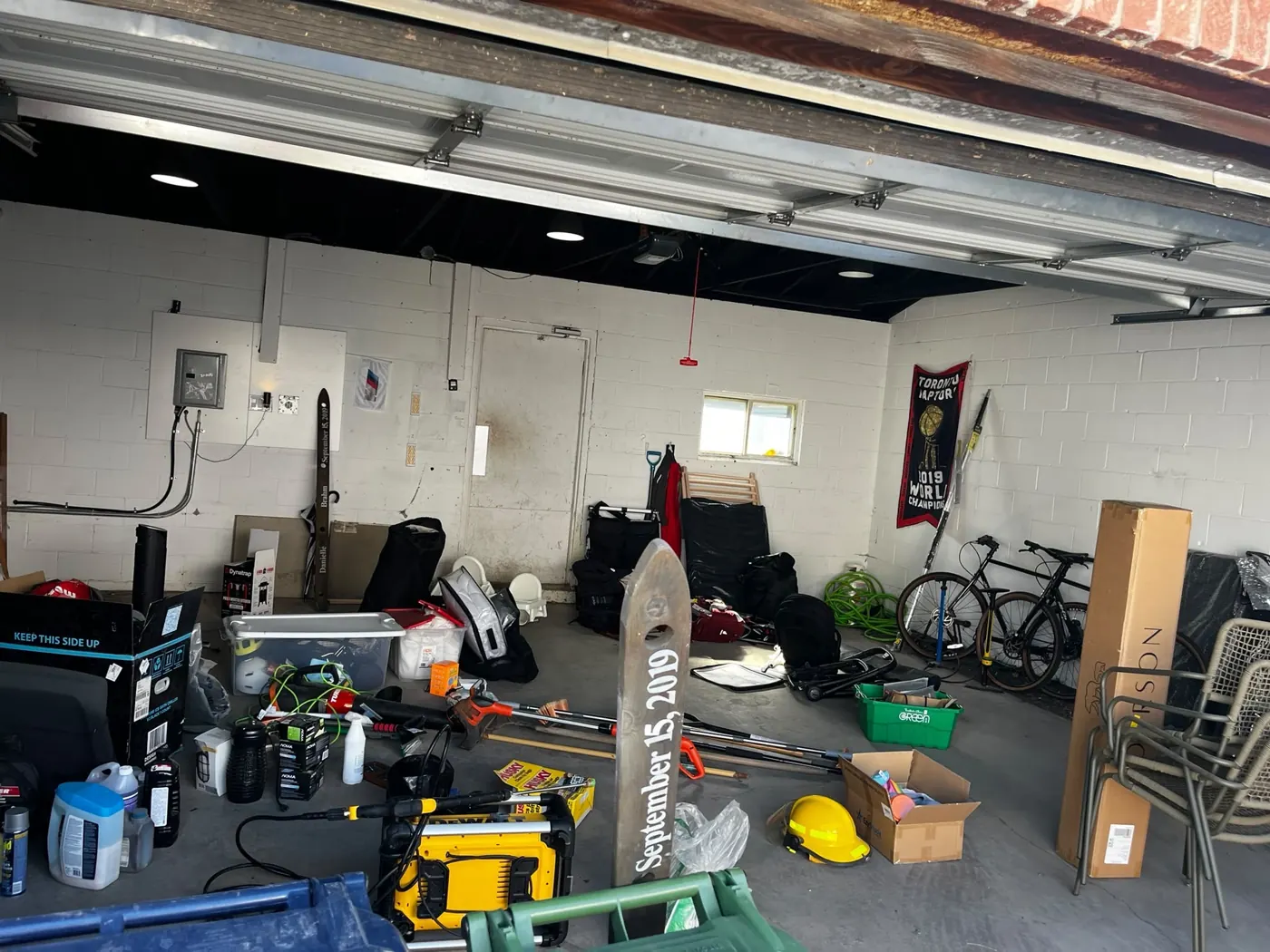Toronto garage before cleaning — packed with tools, bikes and gear